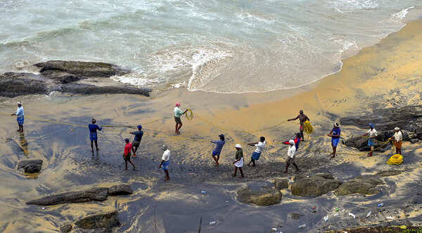 Thiruvananthapuram: Fishermen engage in traditional Kambavala fishing at Vizhinj...