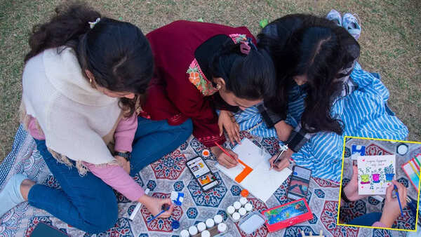 One can spot many groups enjoying an art session while picnicking outdoors