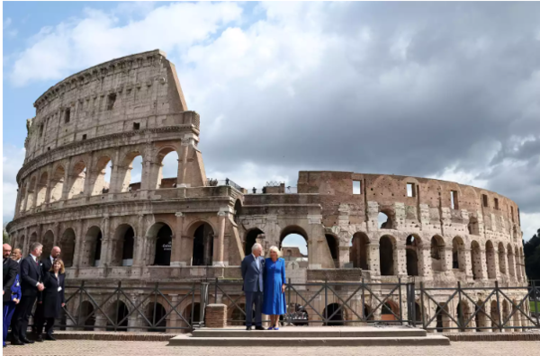 PHIL NOBLE/POOL/AFP via Getty King Charles and Queen Camilla visit the Colosseum in Rome, Italy.
