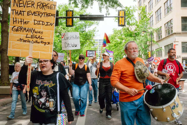 The protesters march to oppose the Trump administration at Fort Worth.