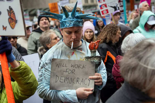 John Rizo attends a rally to oppose the Trump administration at Chicago.