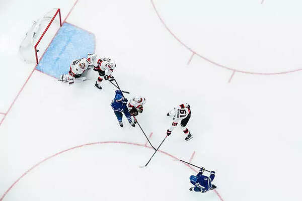 Max Domi #11 of the Toronto Maple Leafs scores an overtime winning goal