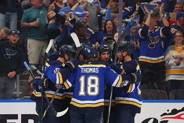 Jordan Kyrou #25 of the St. Louis Blues celebrates with teammates after scoring a goal against the Winnipeg Jets in the third period of Game Three of the First Round of the 2025 Stanley Cup Playoffs