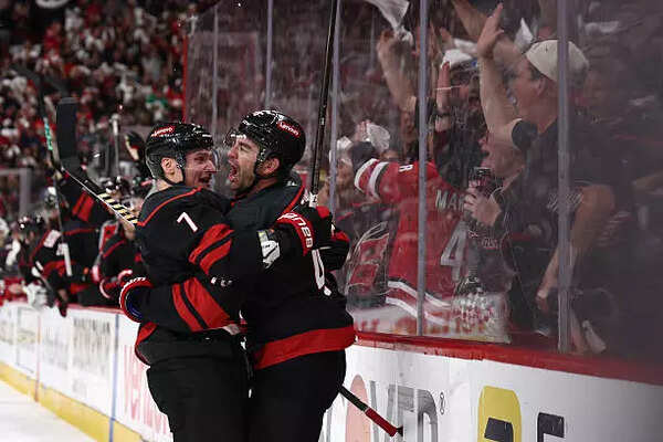 Carolina Hurricanes celebrate after Martinook scored a goal in the second period against the New Jersey Devils in Game Two of the First Round of the 2025 Stanley Cup Playoffs