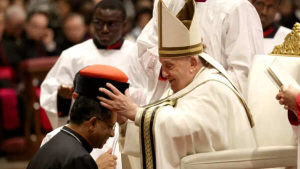 Why was Cardinal Koovakad wearing a white cloak?
