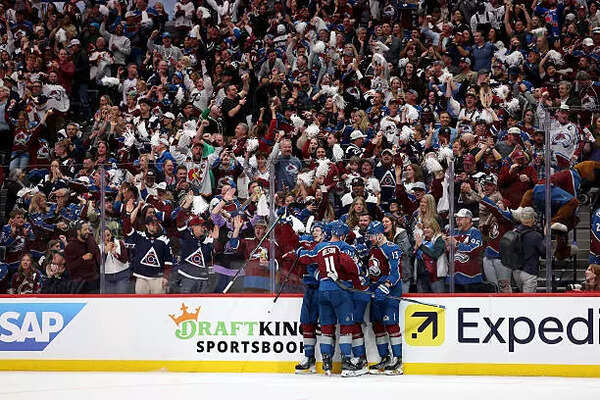 Colorado Avalanche players celebrate with Gabriel Landeskog #92 after his goal against the Dallas Stars during the second period in Game Four of the First Round of the 2025 Stanley Cup Playoffs