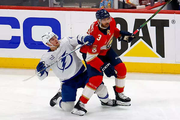 Seth Jones #3 of the Florida Panthers checks Mitchell Chaffee #41 of the Tampa Bay Lightning in the third period of Game Four