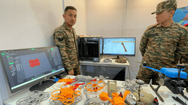Army personnel of the 39 Gorkha Training Centre with the 3D printed drones at Surya Drona Tech-2025 event in Dehradun.