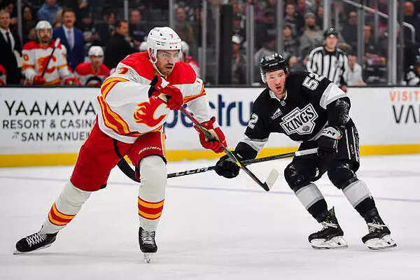 Calgary Flames and Los Angeles Kings battle for position during the first period