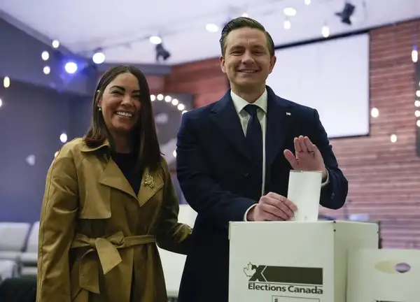 Conservative Leader Pierre Poilievre, right, and his wife Anaida Poilievre cast their votes in the federal election in Ottawa, Canada in Ottawa. (AP/PTI Photo) Conservative Leader Pierre Poilievre, right, and his wife Anaida Poilievre cast ...