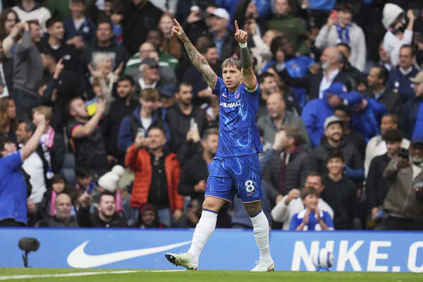 Chelsea's Enzo Fernandez celebrates scoring his side's opening goal during the E...