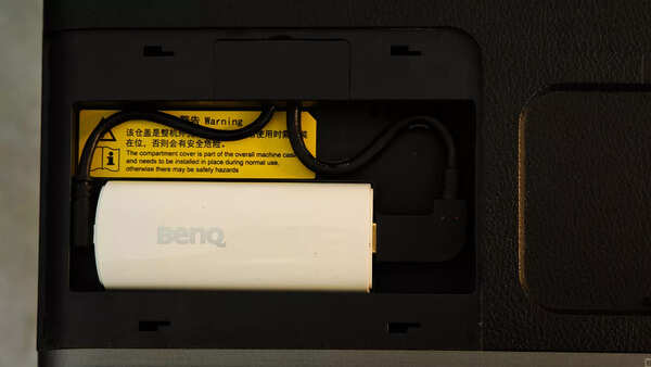 The Android TV dongle is pre-installed into a hidden silo in the projector