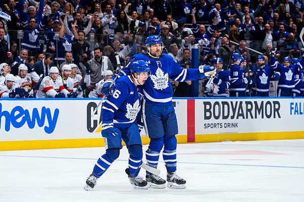 Mitchell Marner (16) celebrates a third period goal