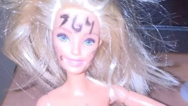 Nude Barbie With 764 Written On Her Head