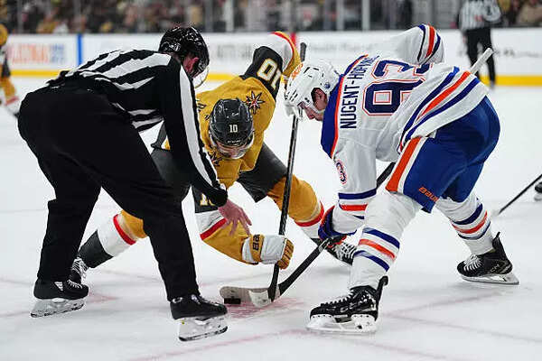 Nicolas Roy #10 of the Vegas Golden Knights faces off against the Edmonton Oilers
