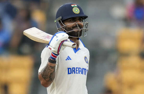 **EDS: FILE IMAGE** Bengaluru: In this file image cricketer Virat Kohli reacts during the test cricket match between India and New Zealand at the M Chinnaswamy Stadium, in Bengaluru. Kohli on Monday announced his retirement from Test cricket, ending a spectacular run in the format which celebrated him as its saviour at a time when T20 cricket took centre-stage globally. (PTI Photo/Shailendra Bhojak) **EDS: FILE IMAGE** Bengaluru: In this file image cricketer Virat Kohli reacts d...
