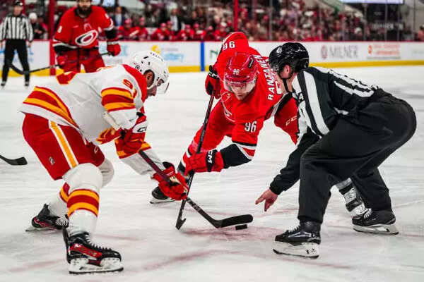 Mikko Rantanen #96 of the Carolina Hurricanes faces off against Nazem Kadri #91 of the Calgary Flames