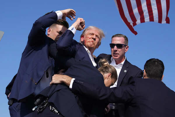 FILE - Republican presidential candidate former President Donald Trump is surrounded by U.S. Secret Service agents at a campaign rally, July 13, 2024, in Butler, Pa. (AP Photo/Evan Vucci, File) Picture of Trump after the assassination attempt displaces Obama portrait at the White House