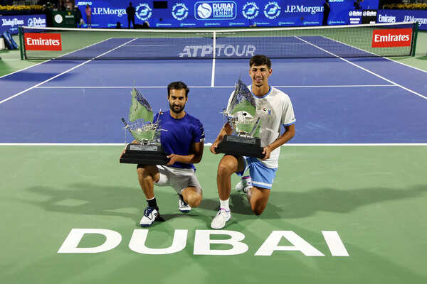 India's Yuki Bhambri and Australia's Alexi Popirin celebrated with their trophies (photo by Christopher Pike/Getty Image) Dubai duty free tennis championship - day fourteen