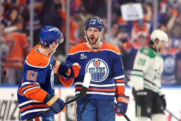 ​Edmonton Oilers celebrates with teammates after scoring a goal​