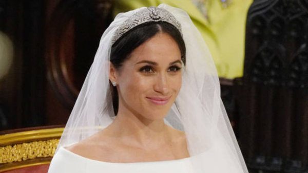 Meghan's use of contouring, smoky eyes, and defined features at her wedding, stood out against the looks other royals