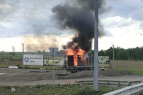 This photo released by Governor of Irkutsk region Igor Kobzev telegram channel on Sunday, June 1, 2025, shows a truck apparently used to release Ukrainian drones seen burning in the Irkutsk region, more than 4,000 kilometers (2,500 miles) from Ukraine. (Governor of Irkutsk region Igor Kobzev telegram channel via AP) Russia Ukraine