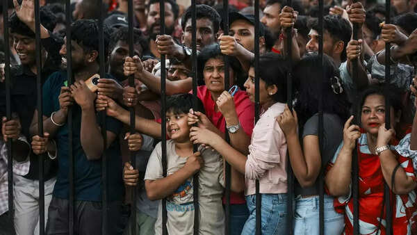 Fans of Royal Challengers Bangalore at Vidhan Sauda in Bengaluru during the team's Felicitation ceremony. (AP) RCB Fan AP
