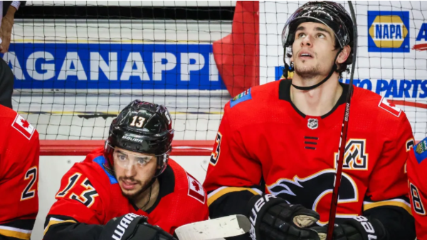 Calgary Flames left wing Johnny Gaudreau (13) and center Sean Monahan (23) on their bench against the Edmonton Oilers during the third period at Scotiabank Saddledome. Mandatory Credit: Sergei Belski-USA TODAY Sports / Sergei Belski-USA TODAY Sports