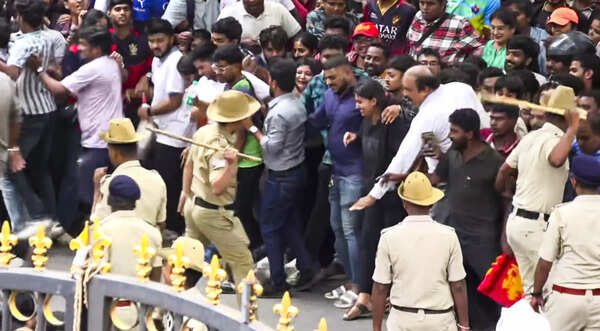 Security personnel tried to manage the crowd of fans gathered for the IPL 2025 felicitation that won the Royal Challengers Bangalore team in Bangalore in Karnataka, Karnataka. (PTI) RCB Felicitation: Stampede near Bangalore Stadium