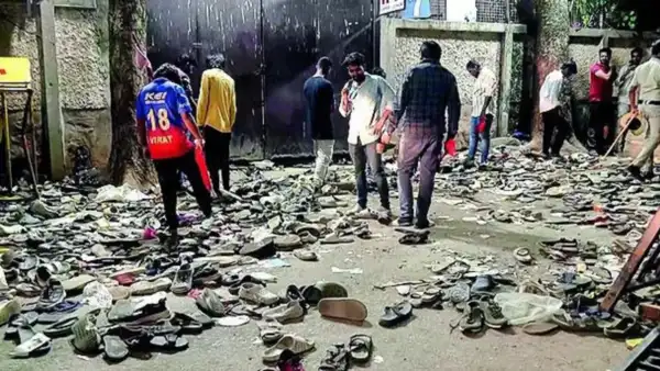 Footwear strewn near one of the gates to Chinnaswamy Stadium on Wednesday. Footwear strewn near one of the gates to Chinnaswamy Stadium Wednesday