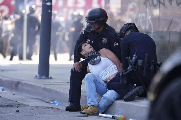 A protestor is detained in downtown Los Angeles, Sunday, June 8, 2025, following last night's immigration raid protest. (AP photo) LA protest