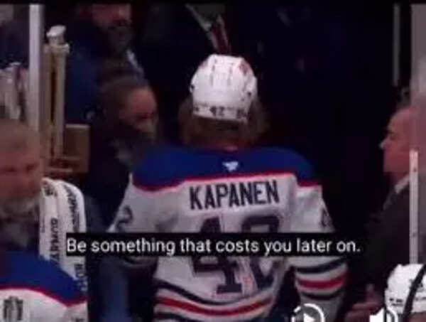 Panthers fan emptying her drink on an Oilers players head as he leaves the ice