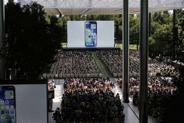 Attendees watch a presentation during an event on the Apple campus in Cupertino, Calif., Monday, June 9, 2025. (AP Photo/Jeff Chiu) Attendees watch a presentation during an event on the Apple campus in Cupertino, Calif., Monday, June 9, 2025. (AP Photo/Jeff Chiu)