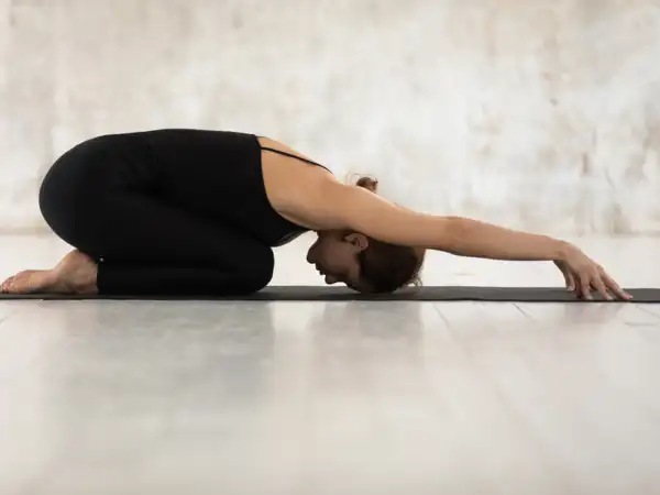 Come to your knees on the ground and sit on your heels. Let your arms fall forward and place your forehead on the mat. Breathe deeply and hold for 1 to 2 minutes, allowing your body to completely relax.Begin your yoga journey with Times Health+ Yoga. Balasana (Child's Pose)