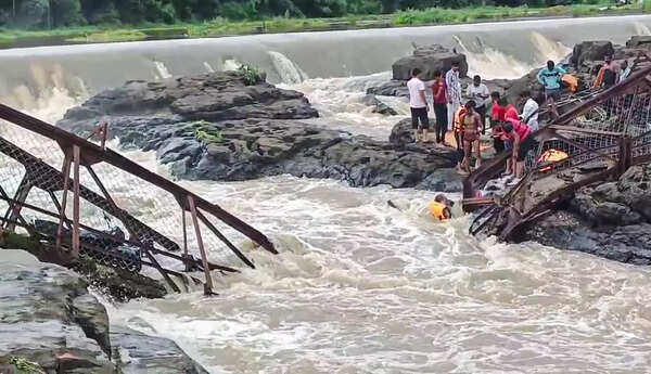 People seen at the site after a bridge collapsed