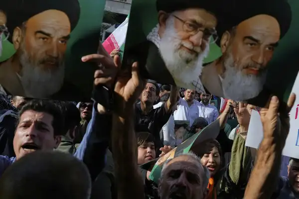 Iranian protesters hold up posters showing the Supreme Leader Ayatollah Ali Khamenei, center, and the late revolutionary founder Ayatollah Khomeini in a protest following the U.S. attacks on Iranian nuclear sites Sunday, June 22, 2025, in Tehran, Iran. (AP Photo/Vahid Salemi) The top photos of the day by AP's photojournalists