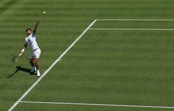 Spain's Carlos Alakraj serves during a practice session before the Championship Wimbledon 2025 at the England Lawn Tennis and Crocket Club (Photo by Clive Brankil/Getty Image) Preview: Championship - Wimbledon 2025