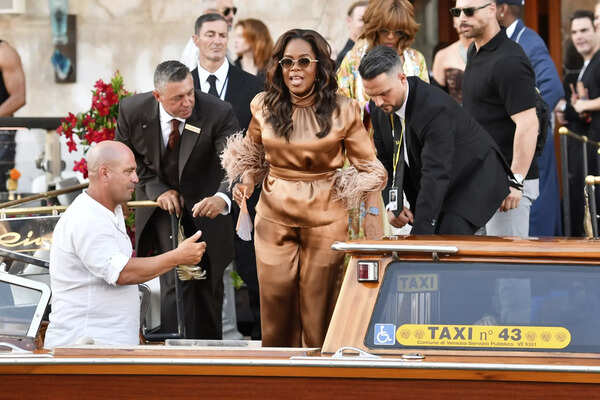 Oprah Winfrey leaves a hotel during celebrations for Jeff Bezos and Lauren Sanchez Bezos' wedding, in Venice, Saturday, June 28, 2025. (AP Photo/Luigi Costantini) Italy Venice Bezos Wedding