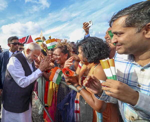 In this image released by PMO on July 4, 2025, Prime Minister Narendra Modi being greeted by people upon his arrival at Piarco International Airport, in Port of Spain. (PMO via PTI Photo) (PTI07_04_2025_RPT019A) PM Modi in Trinidad and Tobago