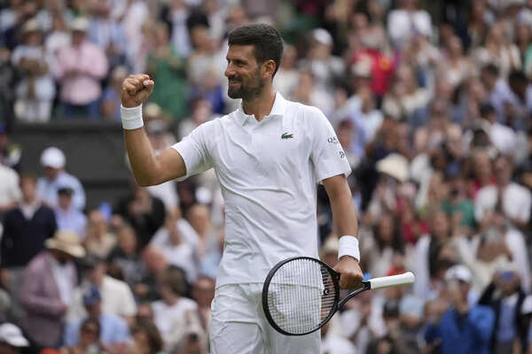 Novak Djokovic celebrates after beating Alex de Minaur during a fourth round men's singles match at the Wimbledon Tennis Championships in London. (AP) Novak Djokovic's 11-year-old son, Stefan, is getting Wimbledon players' autographs. But not Dad's