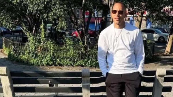 A bench is weirdly warped around his hips