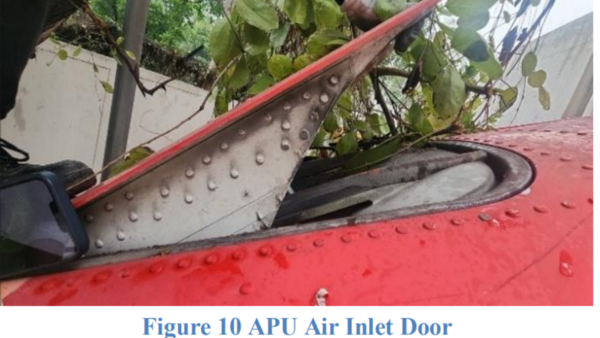 The APU air inlet door (fig. 10), which was intact, was found open. The fuselage fragmented and sustained thermal damage as it traveled along the northwest faces of Buildings C, D, E, and F with the furthest debris observed at about 765 feet southwest from the initial point of contact with building A. (Image credit: Preliminary Report AAIB) (Image credit: Preliminary Report AAIB)