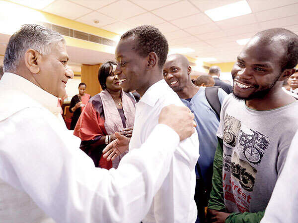 VK Singh, minister of state for external affairs, with Ugandan students Lumu Bedah and Isinde Emmanuel at the Africa Day event on Thursday (BCCL)
