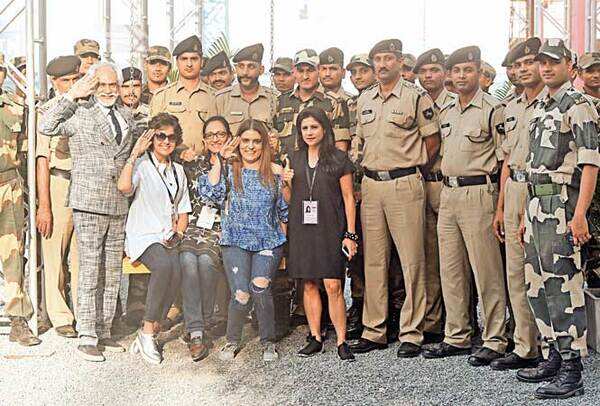 (L-R, front row) FDCI president Sunil Sethi, Payal Jain, Sapna Mehra, Reynu Taandon and Kavita Bhartia pose with the BSF men at the fashion week venue (BCCL)
