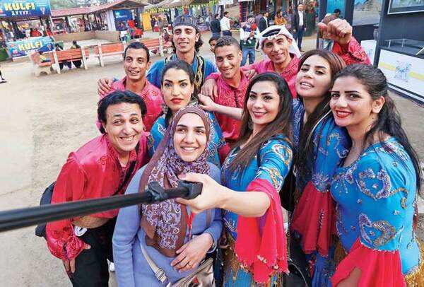 THE SAGA OF SELFIES: The performers of the Egyptian National Folk Dance Group seen indulging in a selfie session at the Mela