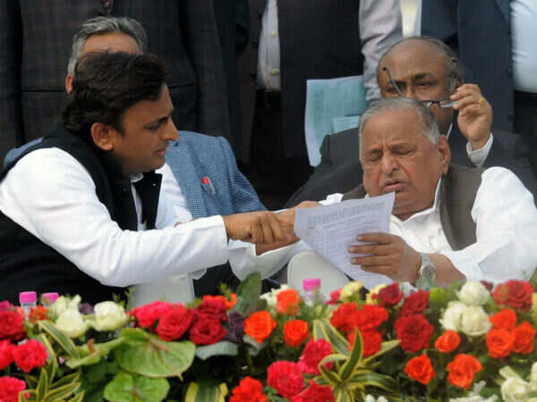 Akhilesh giving a list to Mulayama