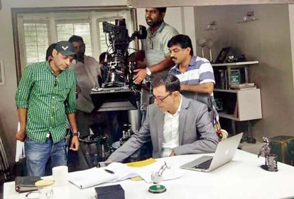 Kamal assisting on an ad shoot with actor Rajat Kapoor
