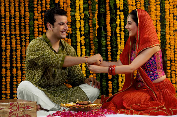 A sister ties rakhi on her brother's wrist during this festival