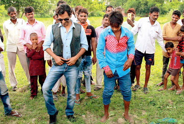 Nawaz dances with a youngster in the village on Swag (BCCL/ Aditya Yadav)