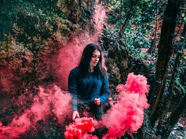 Girl playing with Holi